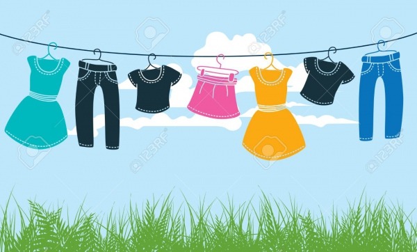 Clothes On Washing Line Against Blue Sky And Green Grass Royalty